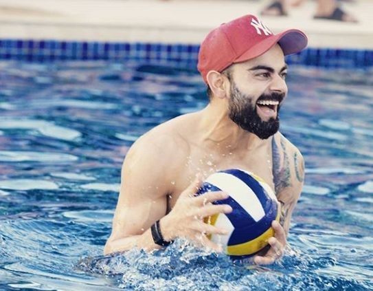 Virat Kohli playing with ball in pool